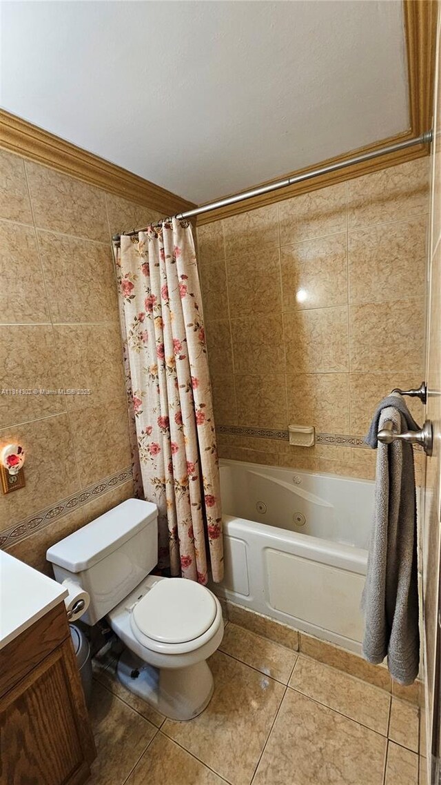 3390 SW 15th Ct, Fort Lauderdale, FL 33312 - full bathroom with tile patterned floors, a combined bath / shower with jetted tub, vanity, and tile walls