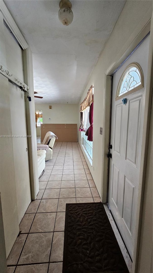 3390 SW 15th Ct, Fort Lauderdale, FL 33312 - foyer with light tile patterned flooring and plenty of natural light