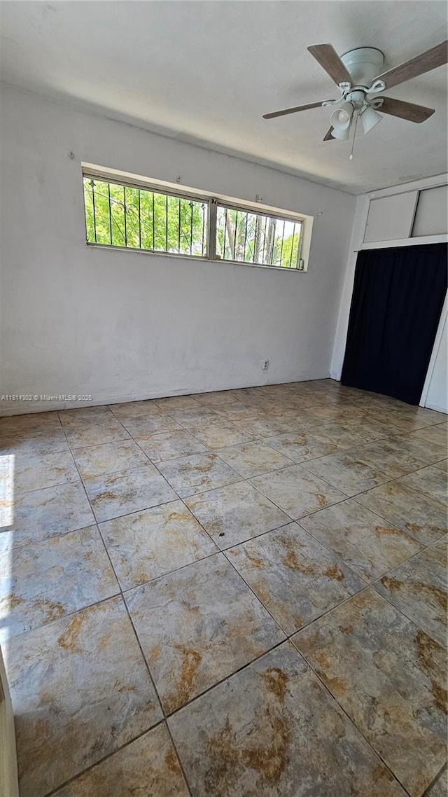 3390 SW 15th Ct, Fort Lauderdale, FL 33312 - spare room featuring healthy amount of natural light and ceiling fan
