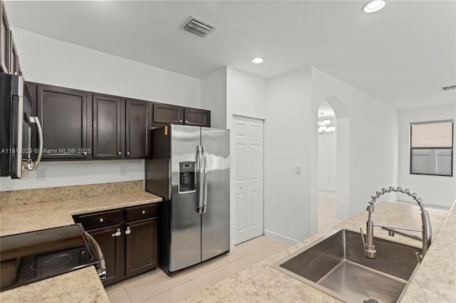 3502 W 86th Ter, Hialeah, FL 33018 - kitchen with stainless steel appliances, a sink, light tile patterned floors, light countertops, and recessed lighting