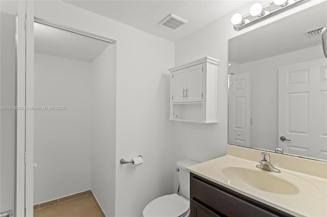 3502 W 86th Ter, Hialeah, FL 33018 - bathroom featuring vanity, tile patterned floors, toilet, and baseboards