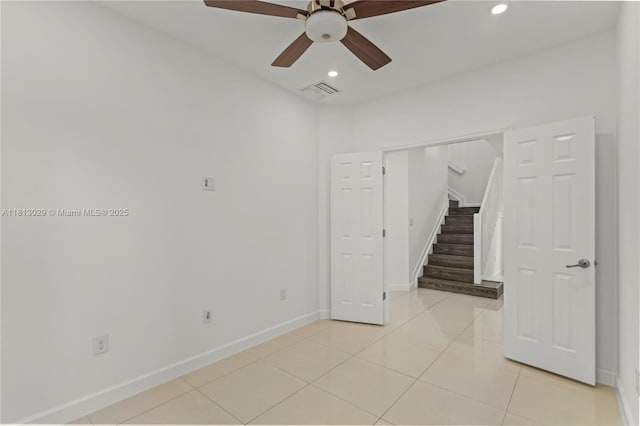 3502 W 86th Ter, Hialeah, FL 33018 - unfurnished room featuring ceiling fan, stairs, recessed lighting, baseboards, and light tile patterned flooring