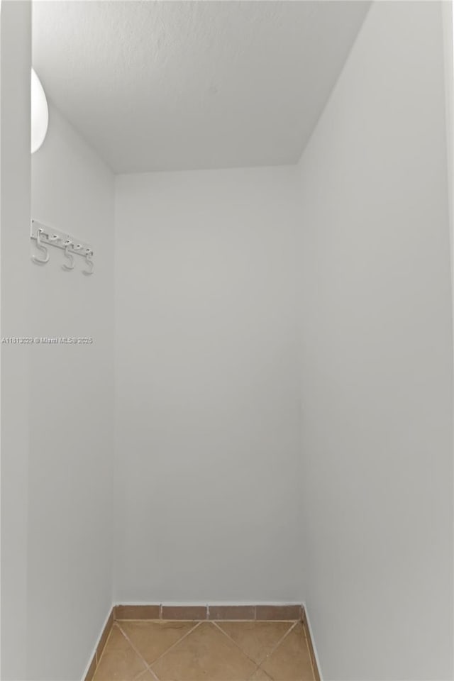 3502 W 86th Ter, Hialeah, FL 33018 - empty room featuring baseboards and light tile patterned floors