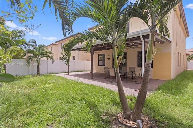 3502 W 86th Ter, Hialeah, FL 33018 - rear view of house featuring stucco siding, a patio, and a ceiling fan