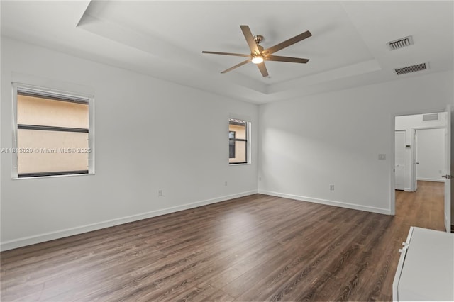 3502 W 86th Ter, Hialeah, FL 33018 - unfurnished room with a raised ceiling, ceiling fan, dark wood-style flooring, and baseboards