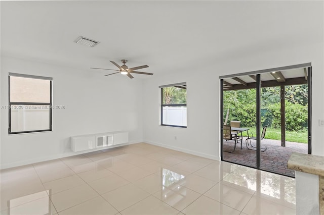 3502 W 86th Ter, Hialeah, FL 33018 - spare room featuring light tile patterned flooring, ceiling fan, and baseboards