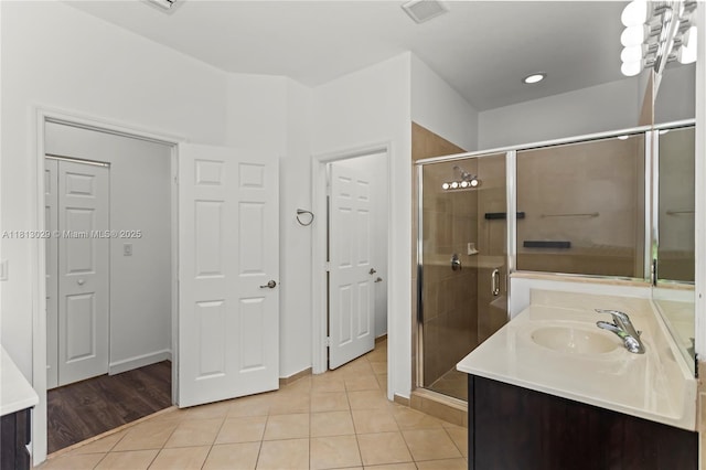 3502 W 86th Ter, Hialeah, FL 33018 - bathroom featuring vanity, a shower stall, and tile patterned flooring