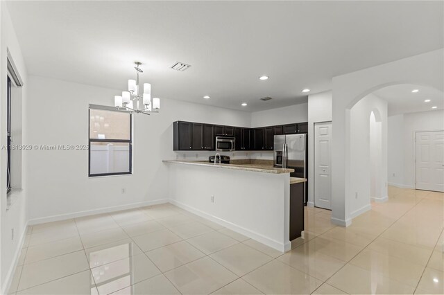 3502 W 86th Ter, Hialeah, FL 33018 - kitchen with stainless steel appliances, light countertops, a chandelier, light tile patterned floors, and recessed lighting