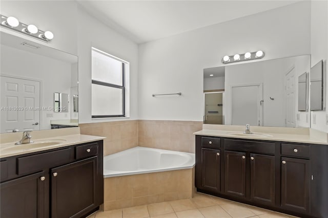 3502 W 86th Ter, Hialeah, FL 33018 - full bathroom with a stall shower, two vanities, a bath, and tile patterned flooring