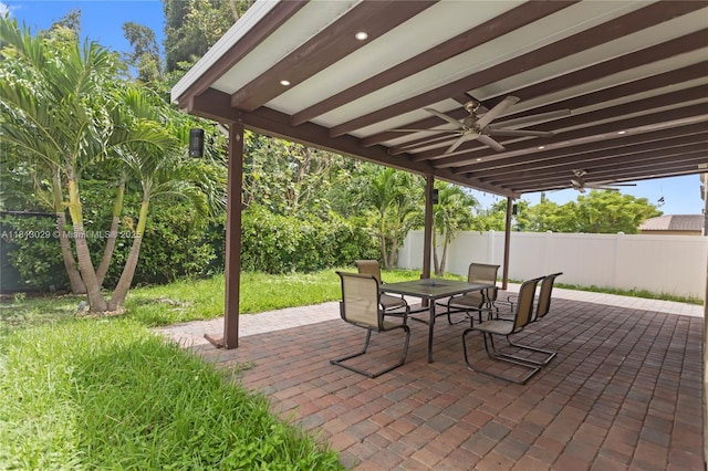3502 W 86th Ter, Hialeah, FL 33018 - fenced backyard featuring outdoor dining space, a patio, and ceiling fan