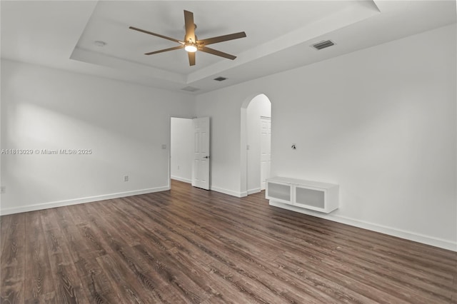 3502 W 86th Ter, Hialeah, FL 33018 - spare room with a raised ceiling, arched walkways, a ceiling fan, dark wood finished floors, and baseboards