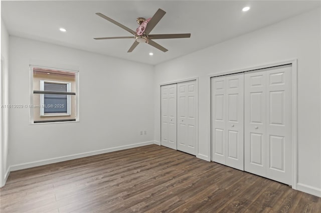 3502 W 86th Ter, Hialeah, FL 33018 - unfurnished bedroom featuring multiple closets, wood finished floors, recessed lighting, baseboards, and a ceiling fan