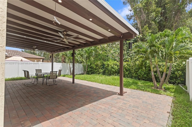 3502 W 86th Ter, Hialeah, FL 33018 - fenced backyard with a patio, a ceiling fan, and outdoor dining area