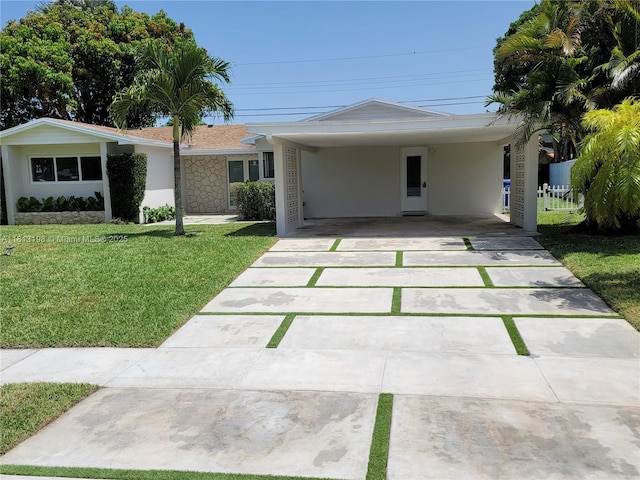 6640 SW 7th St, Pembroke Pines, FL 33023 - ranch-style home with a front lawn, concrete driveway, a carport, and stucco siding