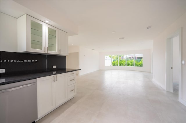 6640 SW 7th St, Pembroke Pines, FL 33023 - kitchen featuring stainless steel dishwasher, open floor plan, white cabinetry, dark countertops, and glass insert cabinets