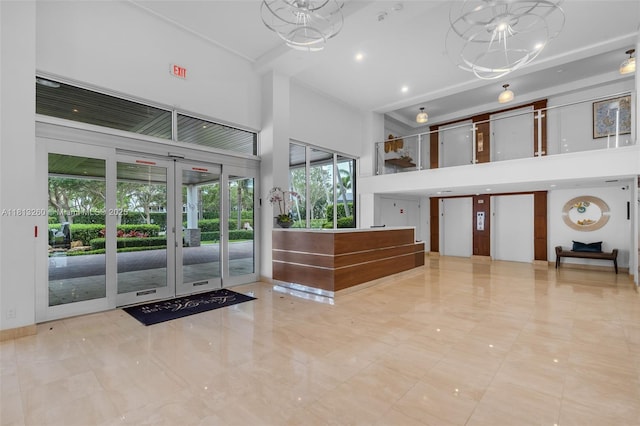 875 E Camino Real Unit 5D, Boca Raton, FL 33432 - welcome area with a towering ceiling and french doors