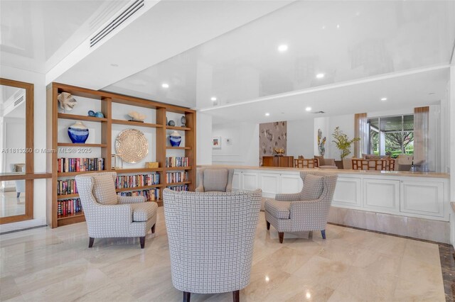 875 E Camino Real Unit 5D, Boca Raton, FL 33432 - living room with built in shelves and recessed lighting