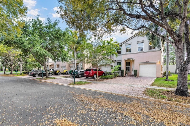 16316 SW 48th St, Miramar, FL 33027 - townhome / multi-family property featuring stucco siding, a garage, and driveway