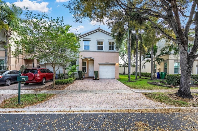 16316 SW 48th St, Miramar, FL 33027 - view of front of home featuring an attached garage, decorative driveway, and stucco siding