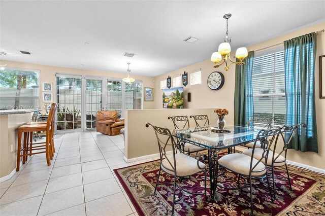 16316 SW 48th St, Miramar, FL 33027 - dining room featuring a chandelier, baseboards, and plenty of natural light