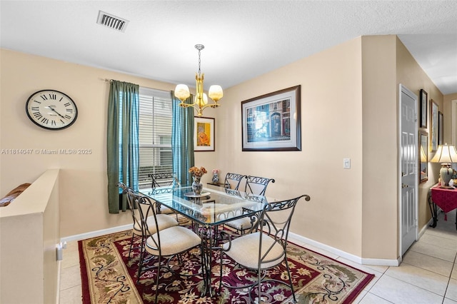 16316 SW 48th St, Miramar, FL 33027 - dining area with a chandelier, light tile patterned floors, and baseboards
