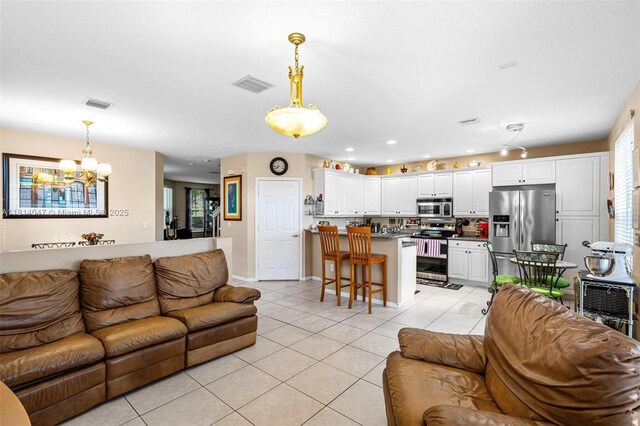 16316 SW 48th St, Miramar, FL 33027 - living room featuring a chandelier, light tile patterned floors, baseboards, and recessed lighting