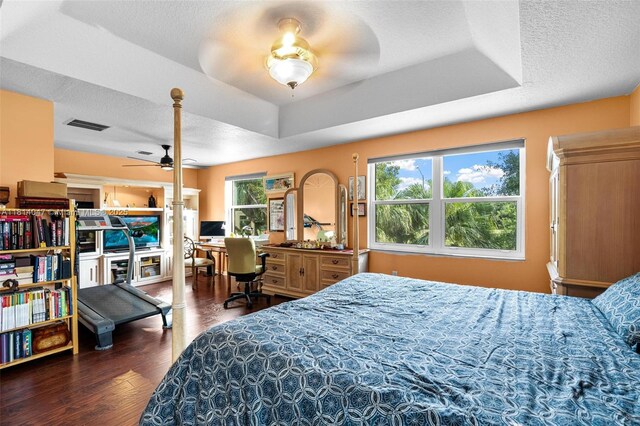 16316 SW 48th St, Miramar, FL 33027 - bedroom with wood finished floors, a raised ceiling, and a textured ceiling