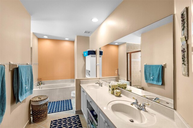 16316 SW 48th St, Miramar, FL 33027 - bathroom featuring a bath, double vanity, tile patterned flooring, a stall shower, and toilet