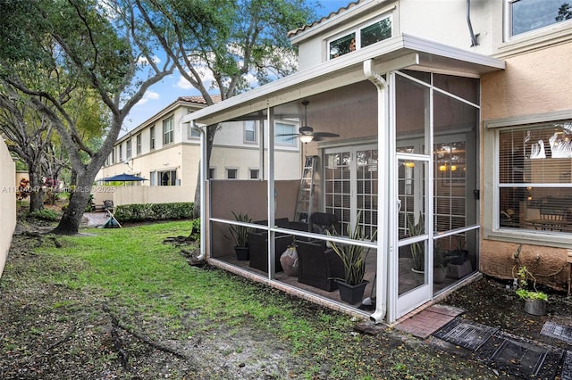 16316 SW 48th St, Miramar, FL 33027 - view of home's exterior with a sunroom, stucco siding, and a lawn