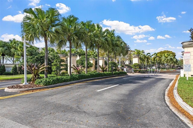 16316 SW 48th St, Miramar, FL 33027 - view of asphalt street with curbs and a gated entry