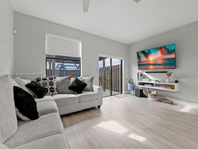 18058 SW 147th Ct, Miami, FL 33187 - living room with wood finished floors and a ceiling fan