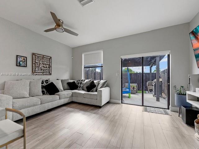 18058 SW 147th Ct, Miami, FL 33187 - living area with a ceiling fan and light wood-style flooring
