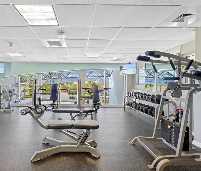 18683 Collins Ave Unit 2510, Sunny Isles Beach, FL 33160 - workout area featuring a paneled ceiling and plenty of natural light