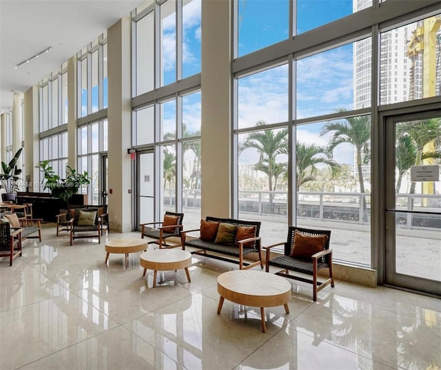 18683 Collins Ave Unit 2510, Sunny Isles Beach, FL 33160 - lobby featuring a towering ceiling and a wall of windows