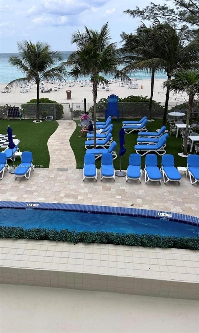 18683 Collins Ave Unit 2510, Sunny Isles Beach, FL 33160 - view of property's community with a water view, a patio area, and a pool