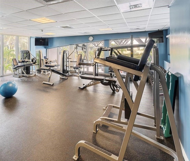 18683 Collins Ave Unit 2510, Sunny Isles Beach, FL 33160 - gym featuring a paneled ceiling and healthy amount of natural light