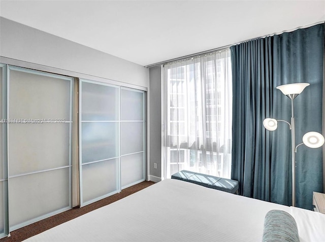 18683 Collins Ave Unit 2510, Sunny Isles Beach, FL 33160 - carpeted bedroom with multiple windows and a closet