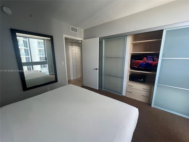 18683 Collins Ave Unit 2510, Sunny Isles Beach, FL 33160 - unfurnished bedroom with a closet and carpet