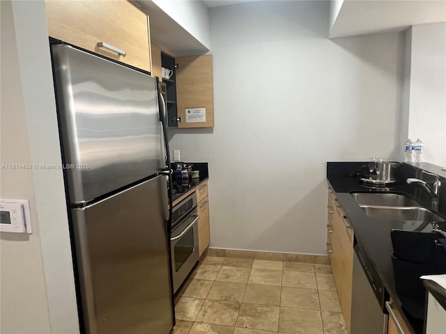 18683 Collins Ave Unit 2510, Sunny Isles Beach, FL 33160 - kitchen with stainless steel appliances, dark countertops, and light tile patterned floors