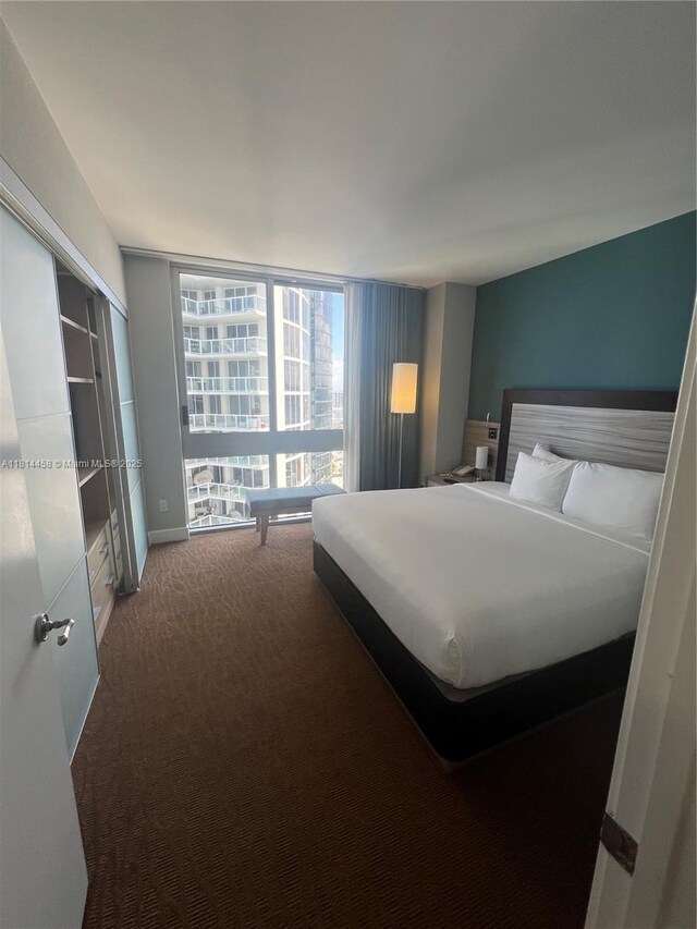 18683 Collins Ave Unit 2510, Sunny Isles Beach, FL 33160 - carpeted bedroom featuring baseboards