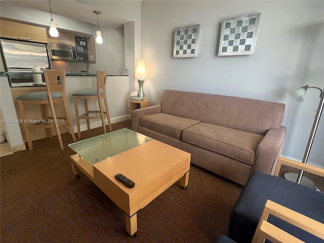 18683 Collins Ave Unit 2510, Sunny Isles Beach, FL 33160 - living room featuring baseboards and carpet
