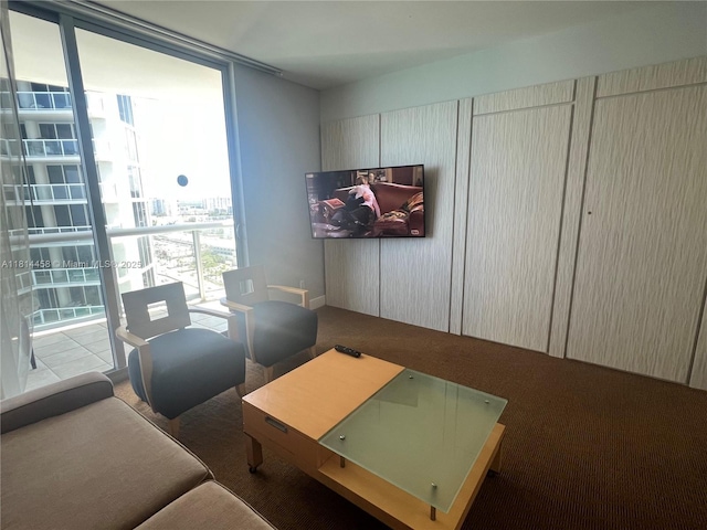 18683 Collins Ave Unit 2510, Sunny Isles Beach, FL 33160 - living area with carpet, a wall of windows, and a desk