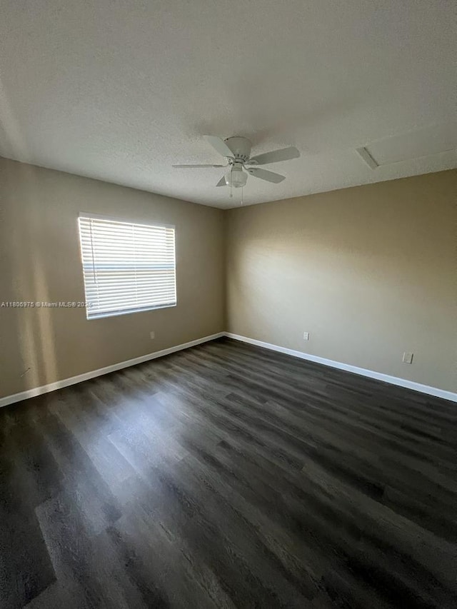 617 Ixoria Ave Unit 18, Fort Pierce, FL 34982 - spare room with dark wood-style floors, baseboards, and ceiling fan