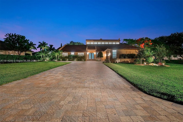 13241 SW 32nd Ct, Davie, FL 33330 - view of front of home featuring decorative driveway and a front yard