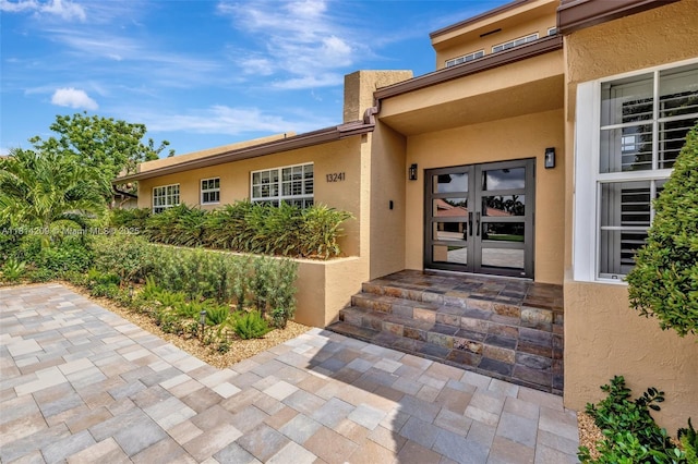 13241 SW 32nd Ct, Davie, FL 33330 - property entrance with french doors and stucco siding