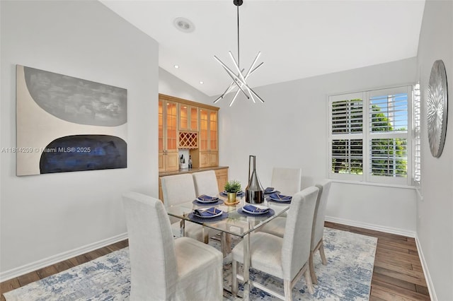 13241 SW 32nd Ct, Davie, FL 33330 - dining area with vaulted ceiling, wood finished floors, a chandelier, and recessed lighting