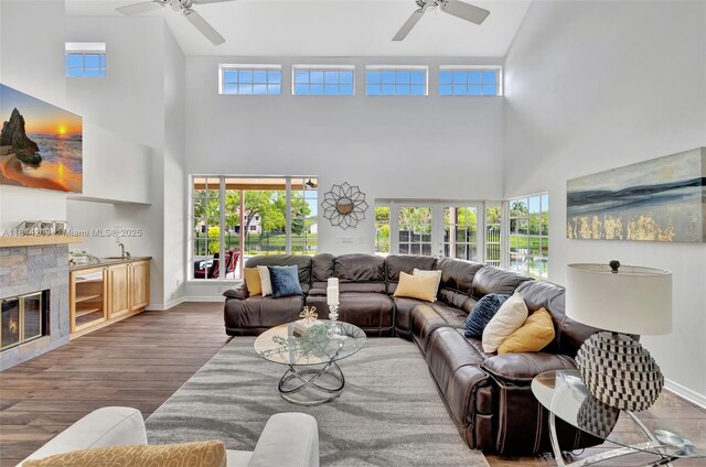 13241 SW 32nd Ct, Davie, FL 33330 - living area with ceiling fan, a towering ceiling, wood finished floors, and healthy amount of natural light