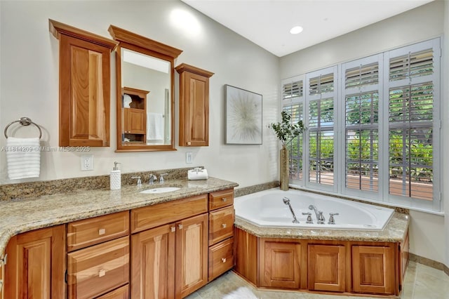 13241 SW 32nd Ct, Davie, FL 33330 - bathroom with vanity, a garden tub, and tile patterned floors