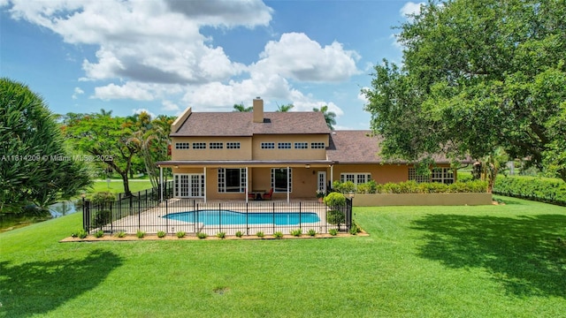 13241 SW 32nd Ct, Davie, FL 33330 - rear view of property with a patio, a chimney, and stucco siding