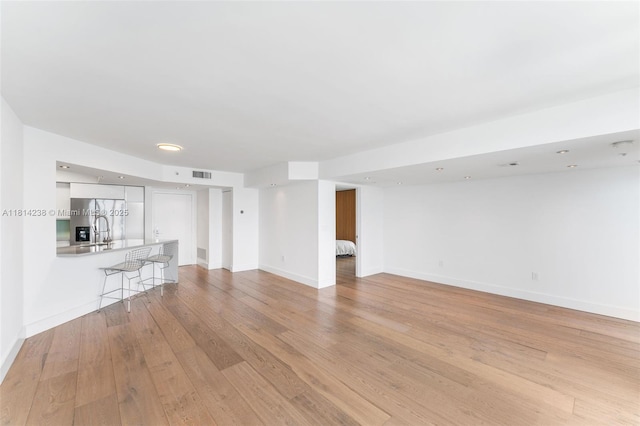 1900 Sunset Harbour Dr Unit 1814, Miami Beach, FL 33139 - unfurnished living room featuring light wood-style floors and recessed lighting